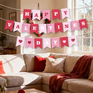 Pink and red Happy Valentine's Day pennant banner hung in a cozy home living room.