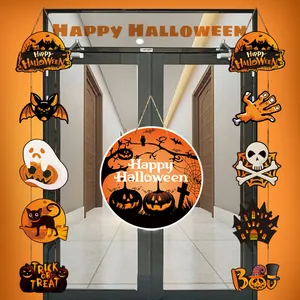 Detail of paper Halloween hanging decorations with pumpkins, ghosts, and bats on a door