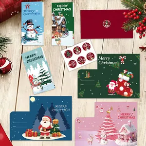 Set of assorted Christmas greeting cards with red envelopes and festive seal stickers