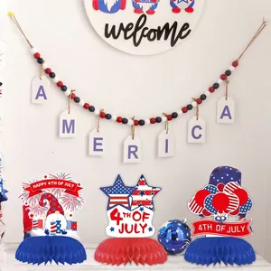Detailed view of three red white and blue 4th of July Independence Day honeycomb table centerpieces