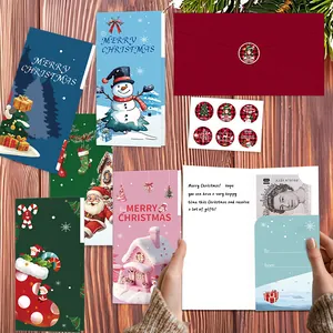 Detailed view of Christmas cards with envelopes and stickers showing a cash pocket feature