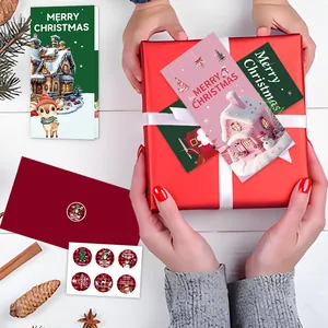 Festive Merry Christmas folded greeting card set with red envelopes and sealing stickers