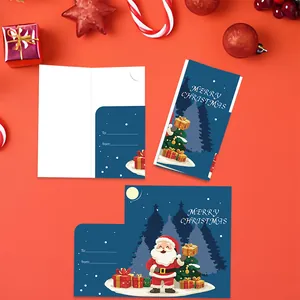 Detailed view of Christmas folding greeting cards with Santa Claus and tree design.