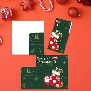 Close-up of Merry Christmas greeting card with festive Santa and stocking illustrations