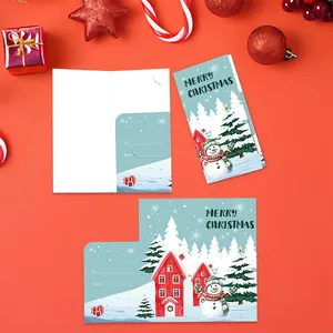 Detail view of festive blue Christmas cards with snowman and house illustrations.