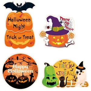 Close-up of four colorful Halloween door signs featuring pumpkins, ghosts, and bats.