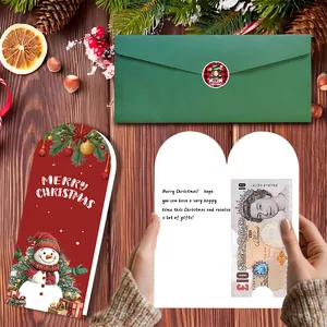 Juego de tarjetas de Navidad con sobre y ranura para dinero que muestra un billete de 10 £
