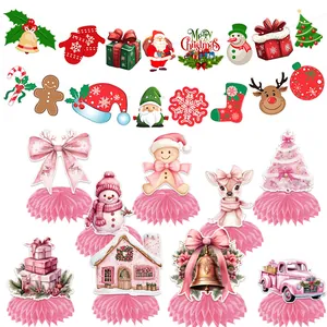 Festive Christmas party decorations with pink bow honeycomb centerpieces and banners
