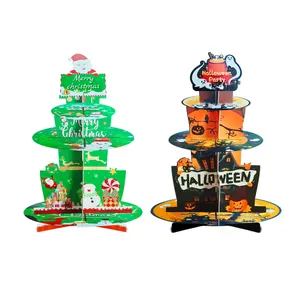 Close-up of three-tier cardboard cupcake stands featuring Christmas and Halloween motifs