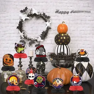 Set van 9 Halloween honingraat tafeldecoraties met pompoen- en spookmotieven.