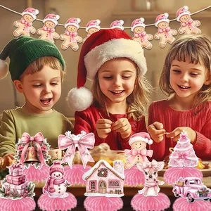 Pink Christmas party decoration set with gingerbread garland and honeycomb centerpieces