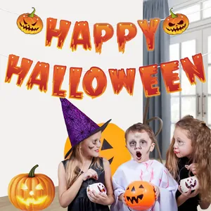 Detail shot of Happy Halloween bunting banner in a festive party setting with children