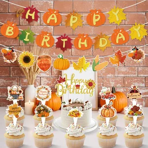Thanksgiving themed birthday party decoration set featuring pumpkin banner and turkey cake toppers