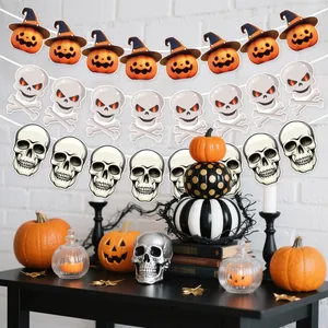 Halloween party banner set with pumpkin and skull designs hanging over a festive table
