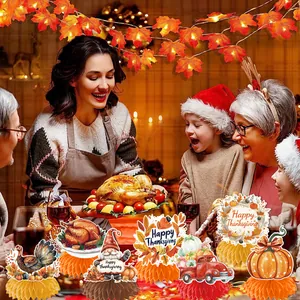Thanksgiving party scene detail featuring decorative paper honeycomb turkey and pumpkin ornaments.