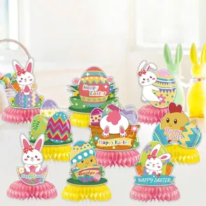 Macro view of vibrant Easter party honeycomb table centerpieces featuring rabbits and eggs