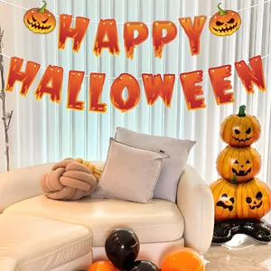 Orange Happy Halloween banner garland hanging in a festive decorated living room setup