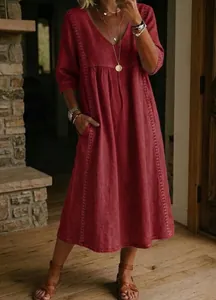 Full view of a boho red linen midi dress with V-neck and delicate lace embroidery details.