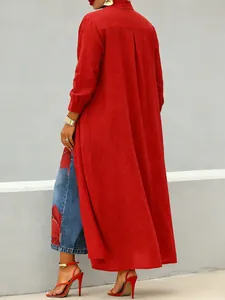 Back view of a vibrant red long-sleeved button-up shirt dress with a sleek lapel.