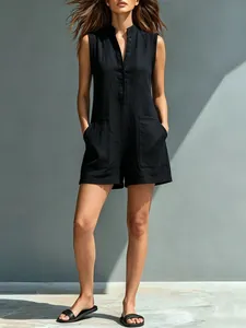 Detailed view of women's black cotton-linen blend sleeveless romper with stand collar.
