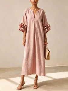 Full view of elegant dusty pink cotton-linen maxi dress with 3D floral sleeve detail