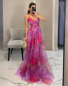 Full-length mesh printed maxi dress with vibrant floral patterns in pink and purple.