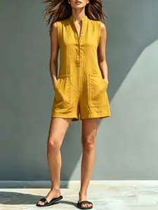 Casual sleeveless yellow cotton linen romper with stand collar and front pockets.