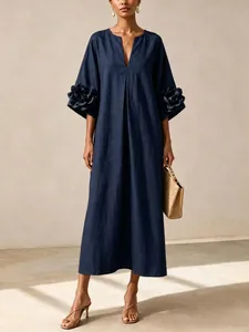 Elegant navy French cotton linen dress with distinctive 3D flower appliqués on sleeves