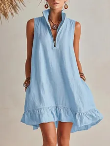 Detail of a light blue cotton linen sleeveless dress with V-neck zipper and ruffle hem