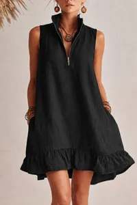Close-up detail of a black sleeveless cotton linen summer dress featuring a ruffle hem