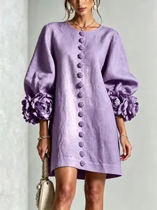 Detail of purple cotton linen dress with 3D floral sleeves and button front design
