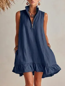 Detailed view of navy blue sleeveless linen dress with zipper V-neck and ruffle hem
