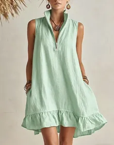 Detail showing mint green sleeveless dress with zipper v-neck and ruffled hem