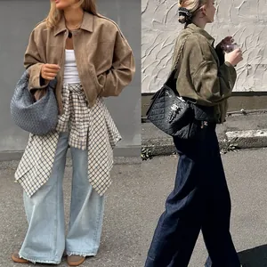 Street style view of oversized suede bomber jackets with stylish batwing sleeves.