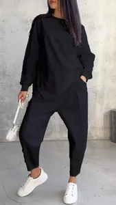 Detail of black women's two-piece casual sweatshirt set with irregular hem