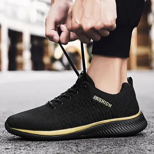 Comfortable black flyknit running shoes for men featuring a stylish gold sole line