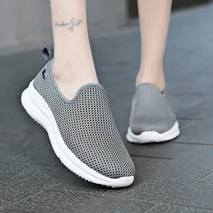 Lightweight breathable grey mesh slip-on sneakers with white soles for casual sport.