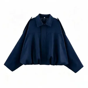 Close-up detail of navy blue faux suede bomber jacket with stylish batwing sleeves