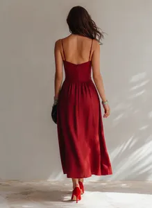 Elegant back view of red spaghetti strap midi dress with pleated waist details