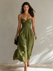 Elegant olive green midi dress with ruched bust detail and thin spaghetti straps