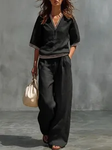 Vista completa de conjunto de lino negro para mujer con cuello en V y pantalón