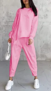 Casual pink two-piece crewneck sweatshirt and pants set with irregular hem details for women