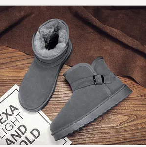 Detail view of gray winter snow boots with warm faux fur lining and metal buckle
