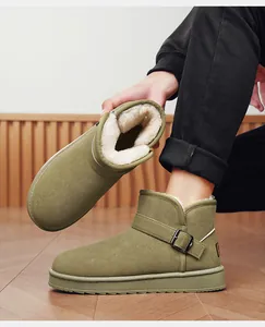 Close-up of olive green snow boots with thick white faux fur lining and buckle