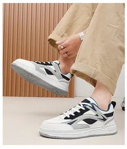Detailed view of men's thick-soled low-top sneakers in white and navy blue