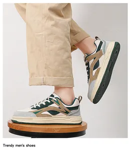 Detailed view of stylish thick-soled men's sneakers in multi-color patchwork design.