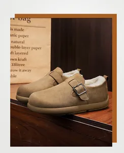 Close-up of khaki suede clogs with warm plush lining and adjustable buckle strap