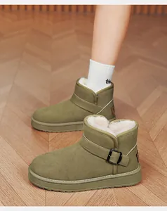 Detailed close-up of olive green winter snow boots with warm faux fur lining and side buckle