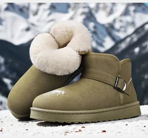 Detail of warm olive green winter snow boots with thick white faux fur lining.