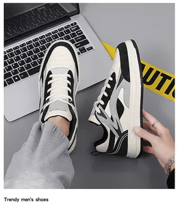 Close-up detail of men's trendy thick-sole sneakers in black, white, and grey colors.